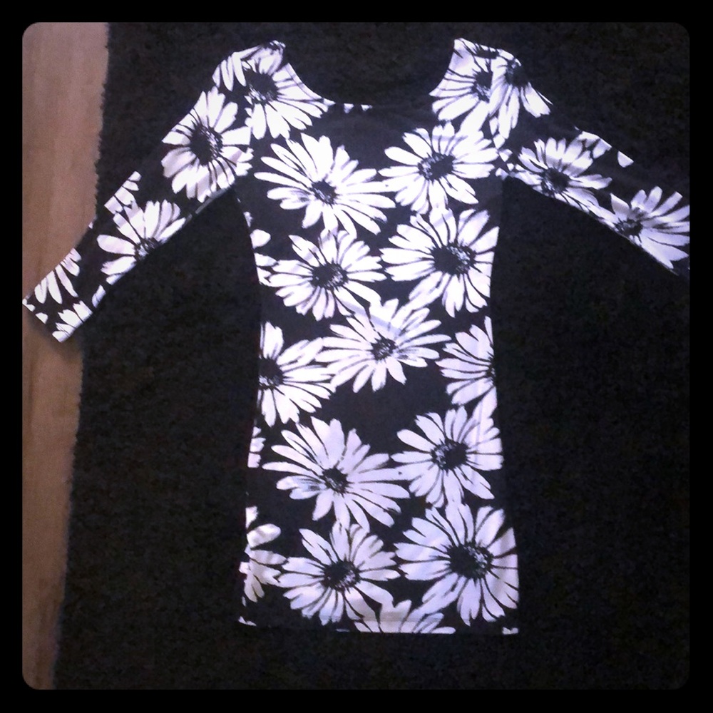 Form fitting black and white sunflower dress.